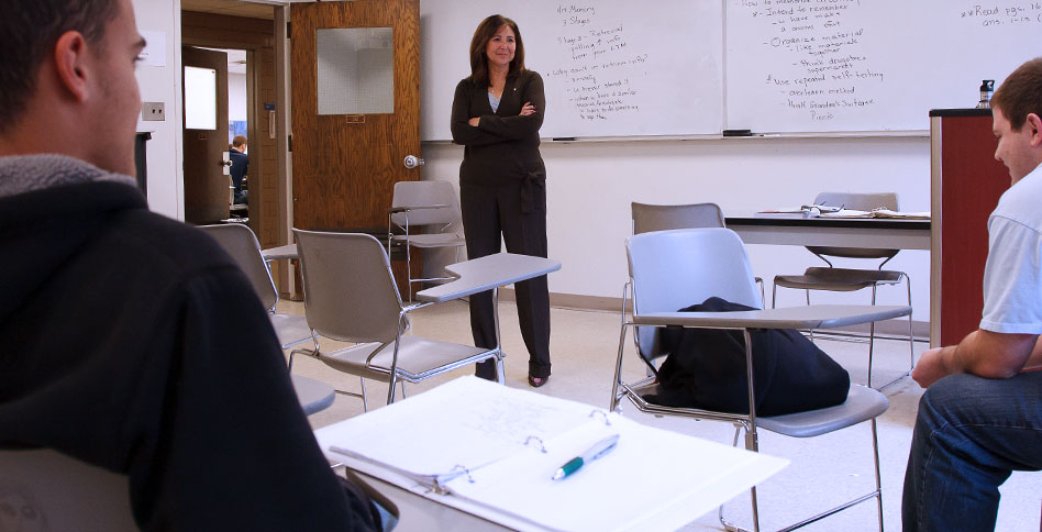 teacher lecturing at front of classroom teacher lecturing at front of classroom