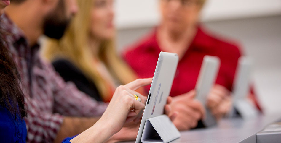 people using touchscreen tablets people using touchscreen tablets