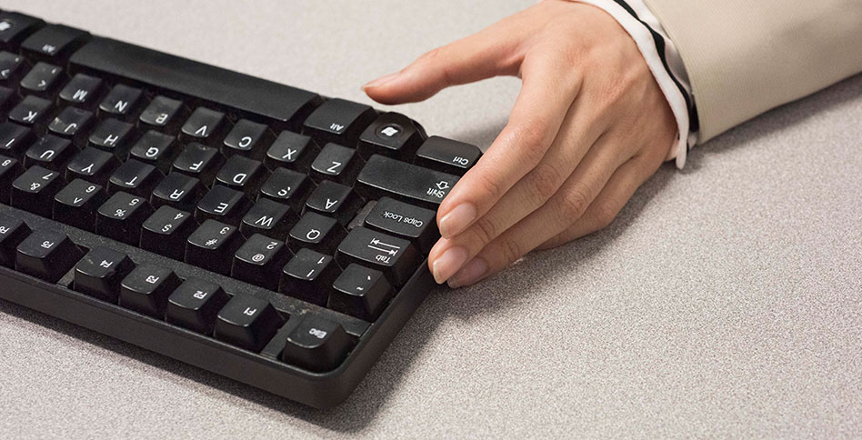 hand using keyboard hand using keyboard
