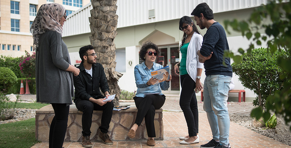 students standing and talking in courtyard students standing and talking in courtyard