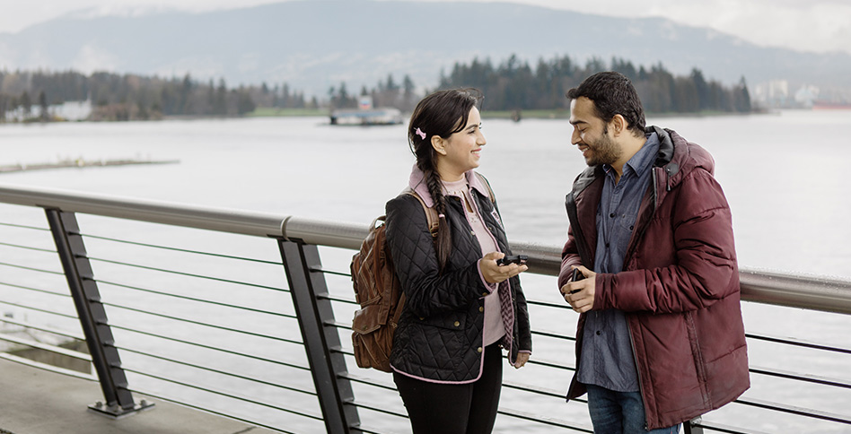 students talking near river students talking near river