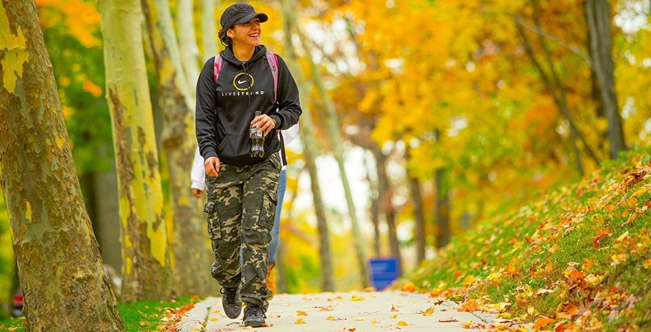 student walking on campus student walking on campus