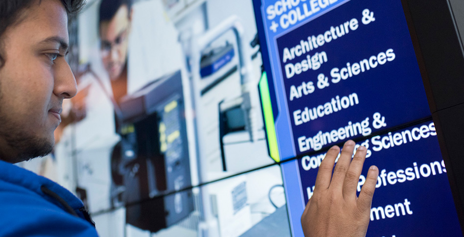 student using interactive sign board student using interactive sign board