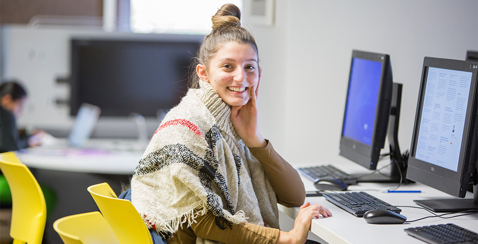 Female student in front of computer Female student in front of computer