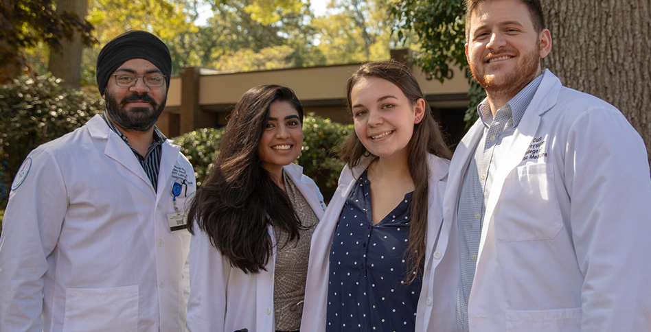 Medical students smiling outside