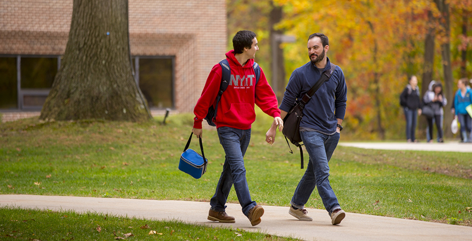 Two students walking around campus on Long Island