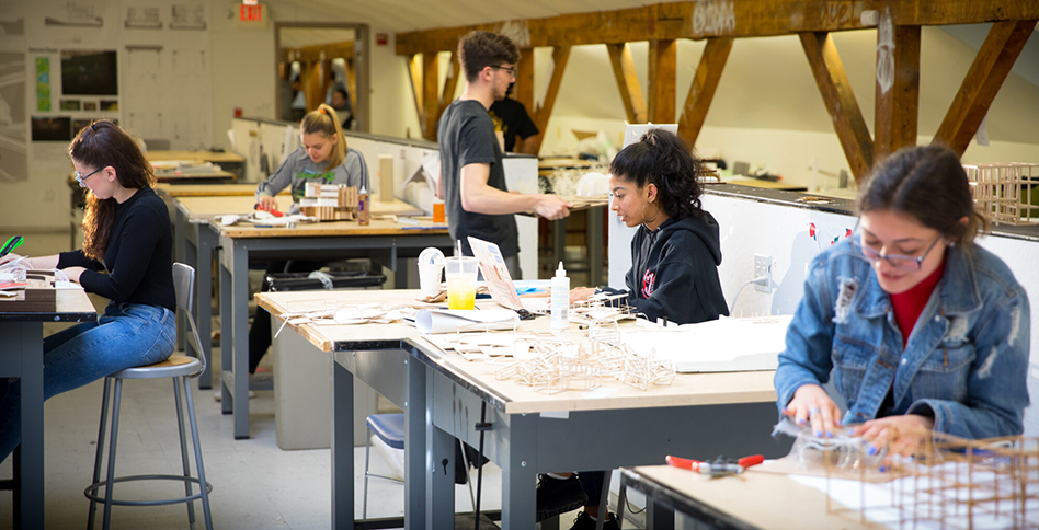 Students working at drafting tables in lab