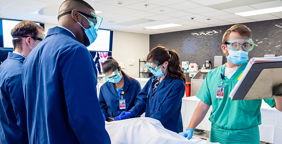 Doctors working on patient in operating room