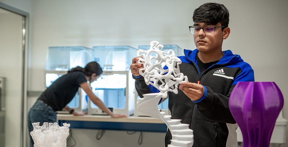 Students handling 3d printed objects