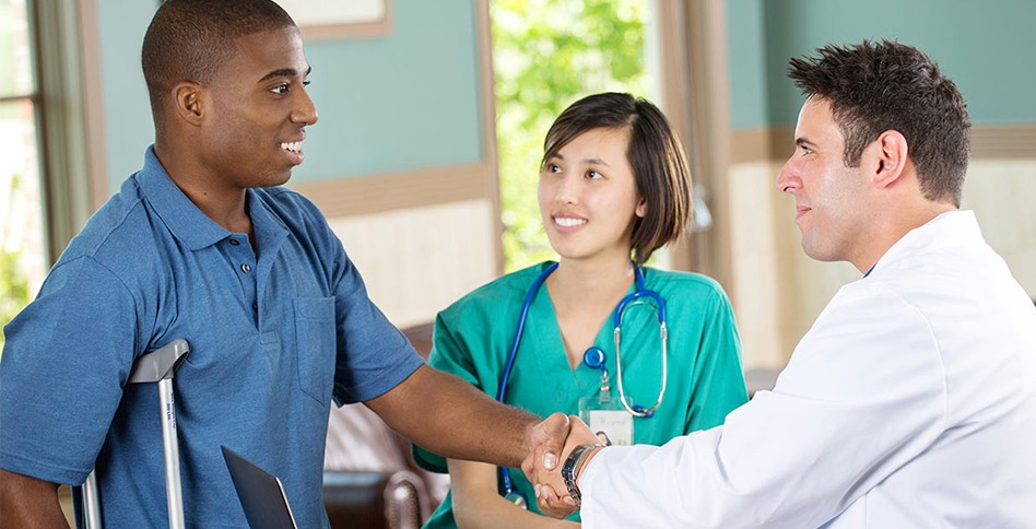 Patient, doctor, and nurse shaking hands