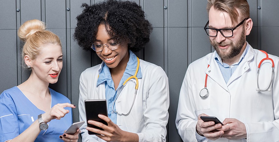 Doctors looks at phones