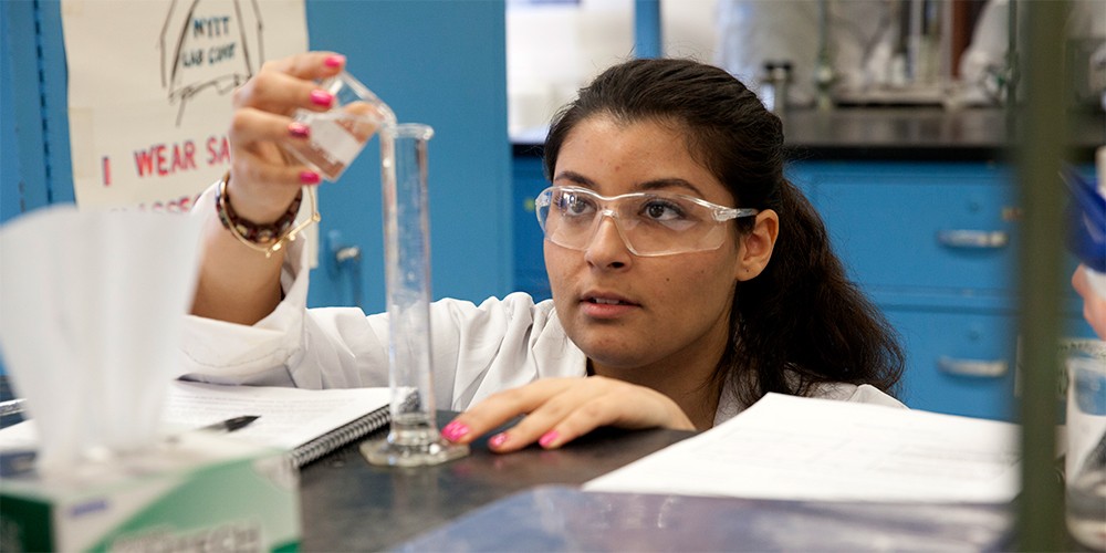 Student working with liquids in a lab