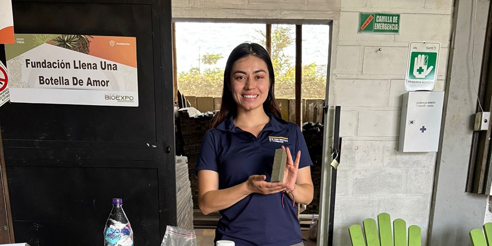 Student holding up sample