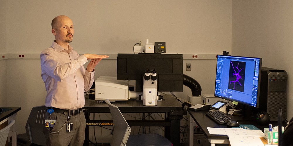 Faculty with digital microscope