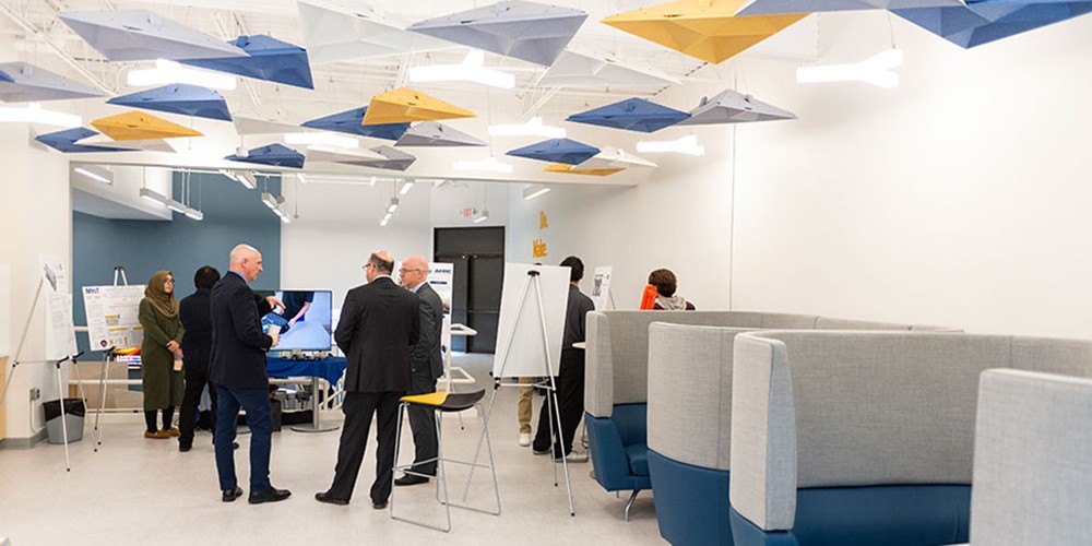 Faculty talking in lab