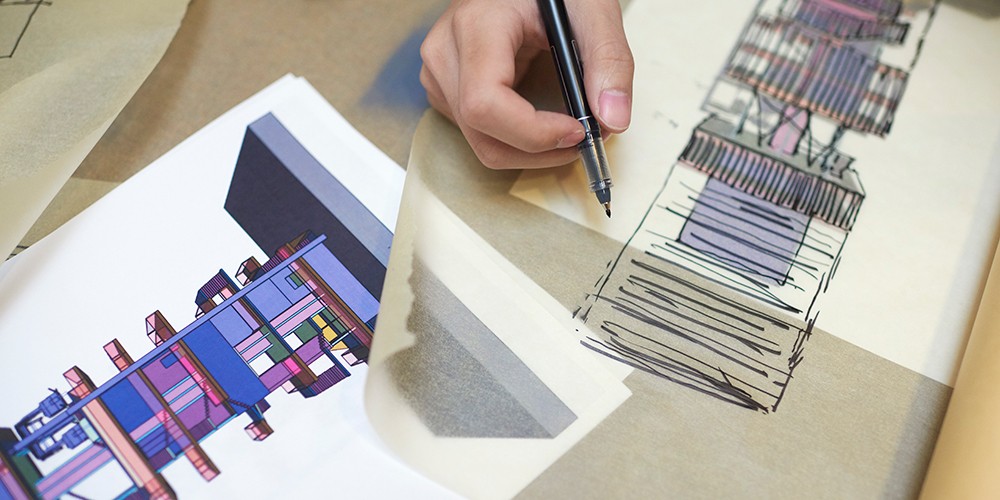 Student writing architectural plans.