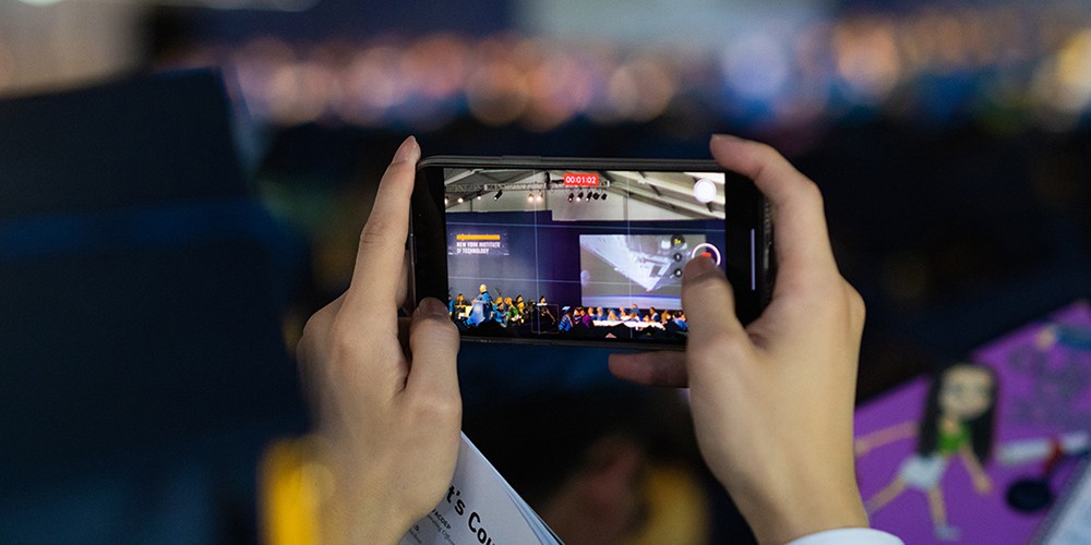 Hands holding cell phone