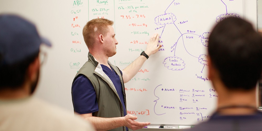 Student teaching at whiteboard