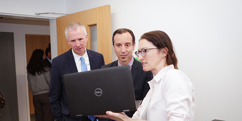 People looking at laptop screen