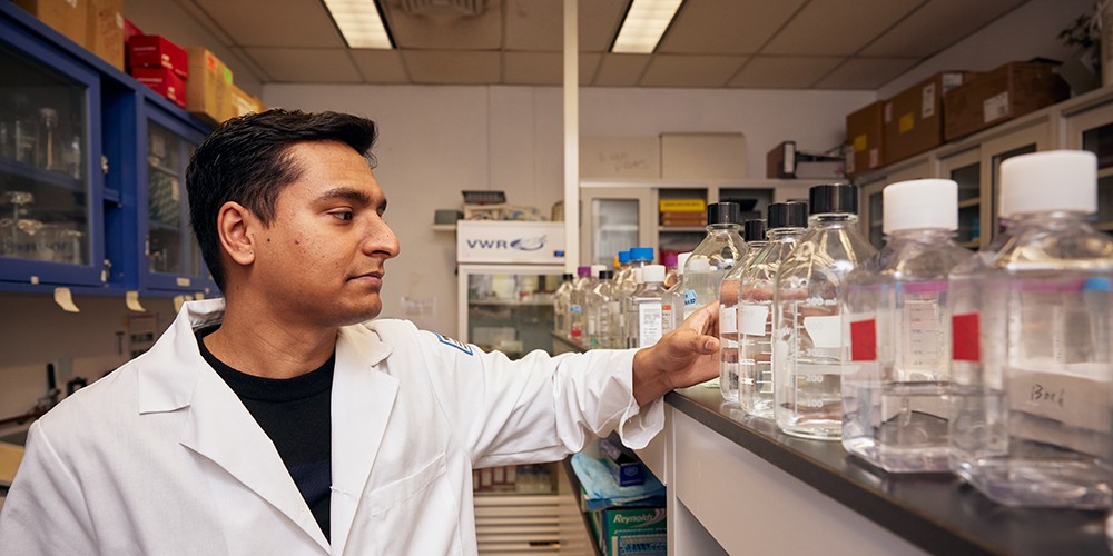 Doctor holding beaker