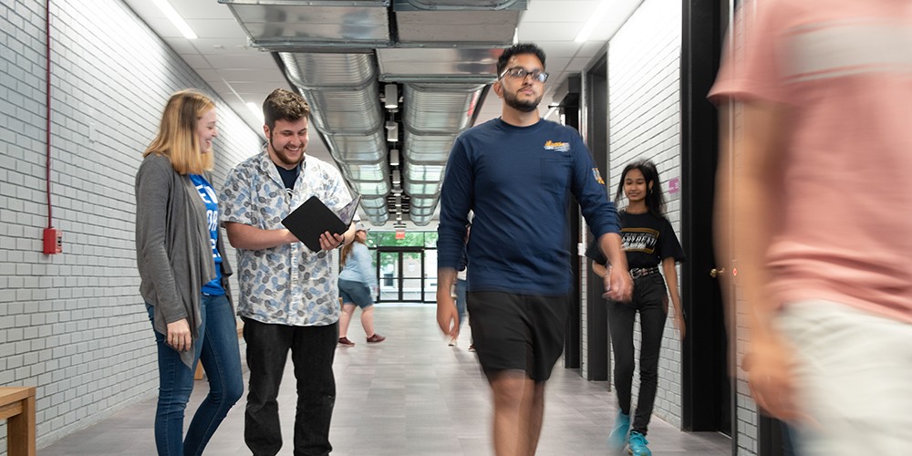 Students walking down hallway