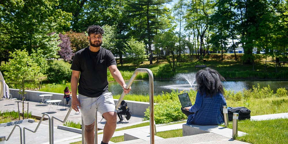 Student walking up campus stairs