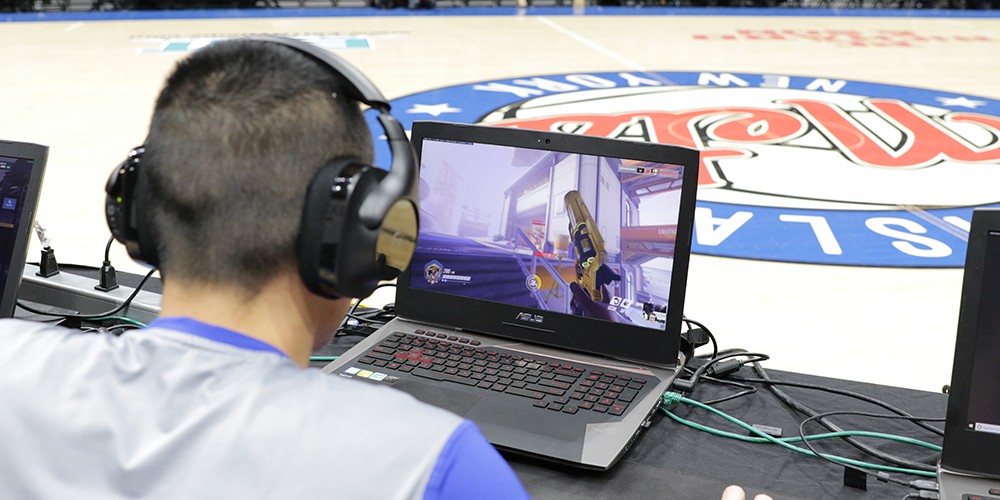 Student playing digital game on laptop