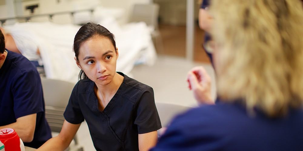 Student watching faculty teaching