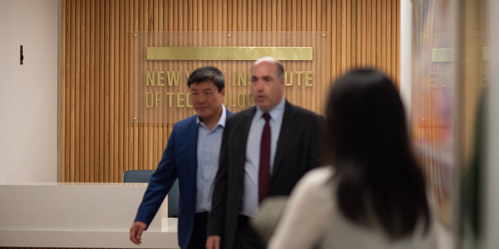 Faculty walking down hallway