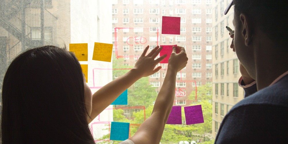 Students making flow chart with post it notes